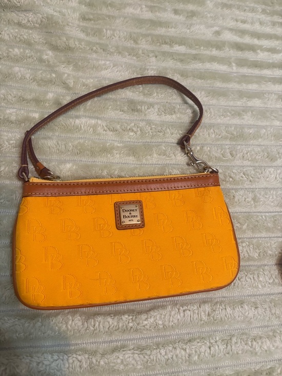 Dooney & Bourke Handbags - Dooney & Bourke Dandelion Coated cotton/orange Embossed DB Wristlet w/Brown Trim